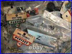 Lot of vintage Cox R/C model airplane engine parts supplies tools etc