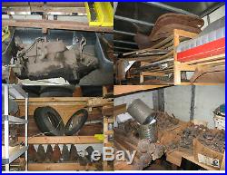 Model T and TT parts around 24,000 pounds of them & box trailer with shelves