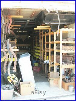 Model T and TT parts around 24,000 pounds of them & box trailer with shelves